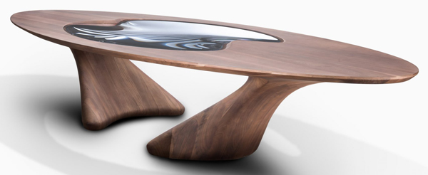 The large dining table features an oval-shaped top with a lenticular glass eye at the centre